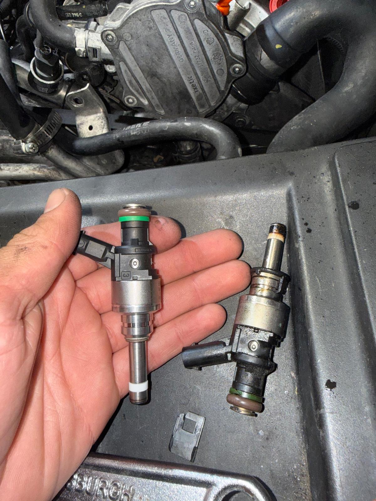 New and faulty Audi Q7 fuel injectors compared