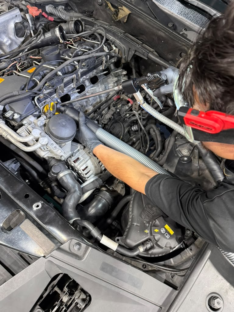Joel Maldonado performing a vehicle repair