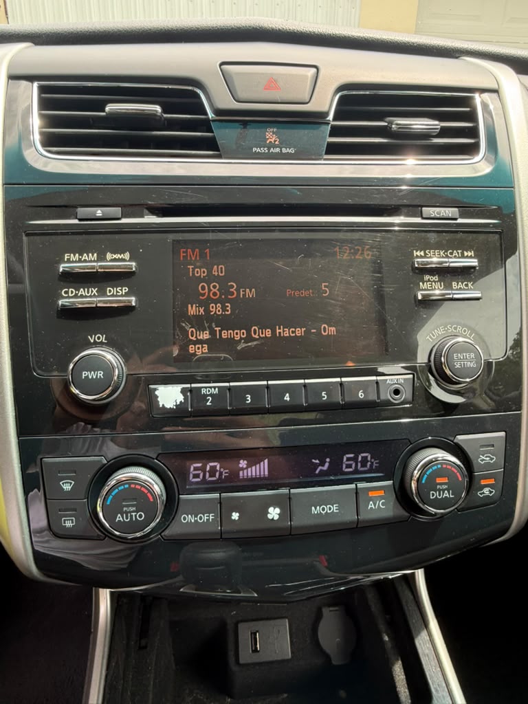 Climate and audio controls checked during the inspection